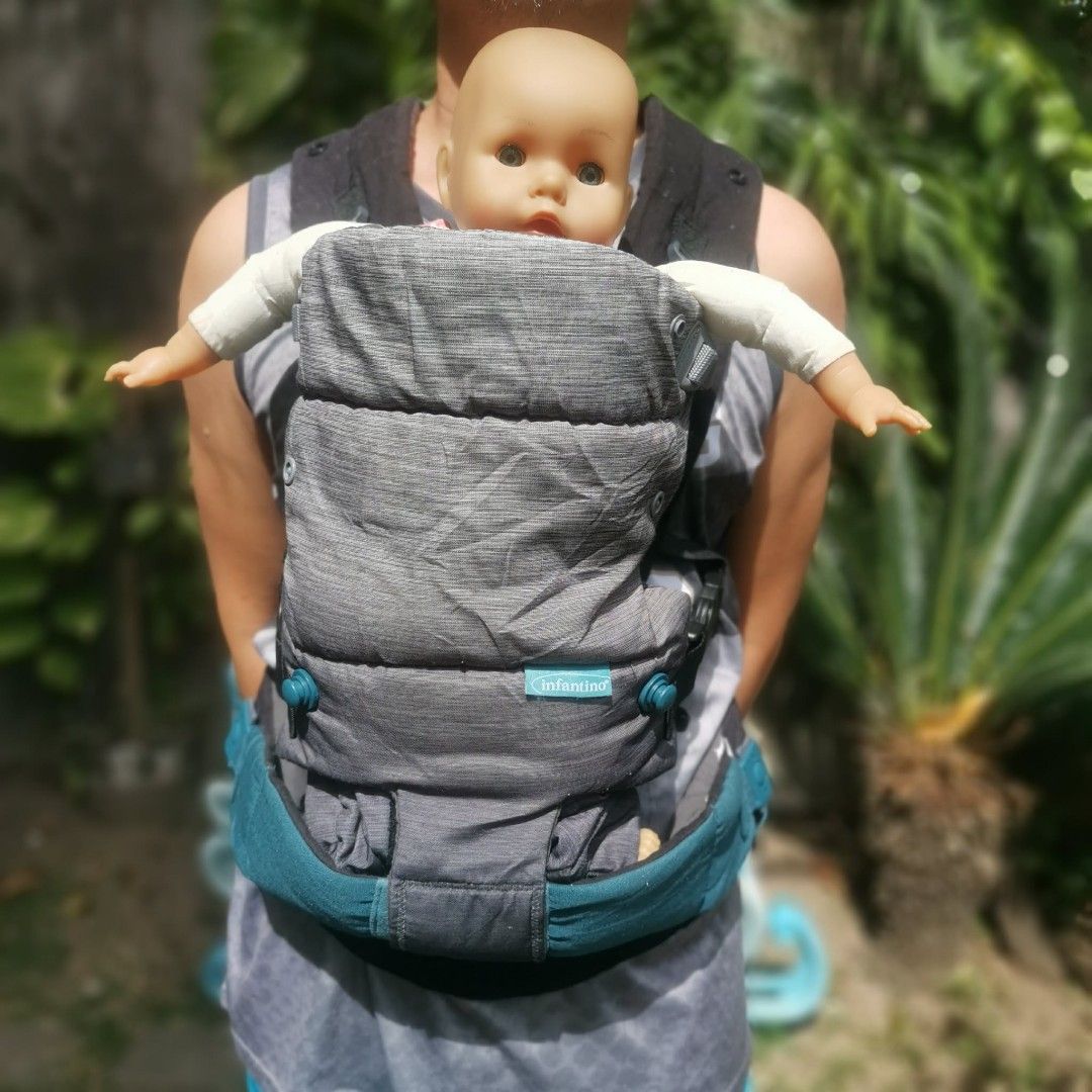 Infantino Baby Carrier (Category: Carriers & Slings) located in Manila. Submitted by titojay (Listing ID 1415468995, Image 3). Description: - Infantino baby carrier - Color: Gray and Teal - Adjustable straps and buckles - Front and back carrying positions - Padded seat and head support - Comfortable for baby.