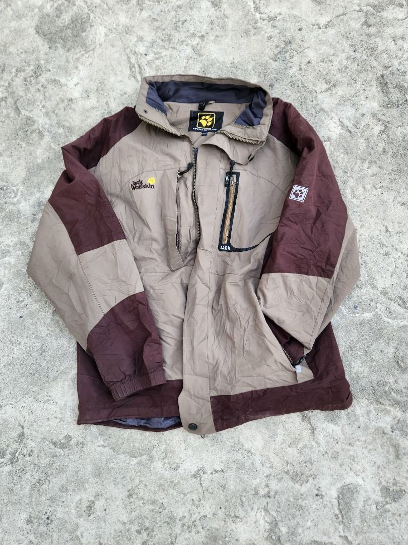 Jack Wolfskin Jacket (Category: Coats, Jackets and Outerwear) located in Caloocan City. Submitted by kiarachavezcarpio19 (Listing ID 1415482810, Image 1). Description: Jack Wolfskin jacket in brown and beige color. Features a zip closure, multiple pockets, and the Jack Wolfskin logo on the chest and sleeve. The jacket has a high collar for added protection. TOMMY HILFIGER HEAVY COTTON KNITTED HOODIE 10/10 BEST FIT S-M 20X26 450.