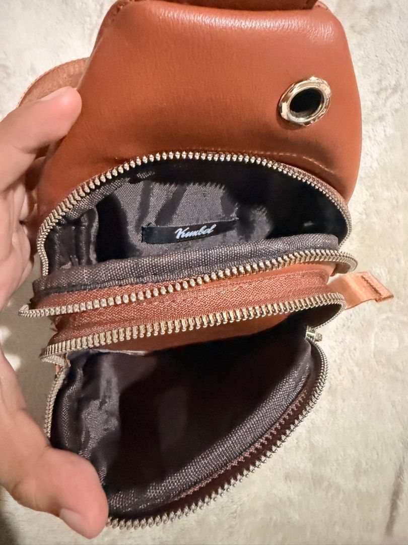 Kimbel Sling Bag - Brown (Category: Cross-body Bags) located in Manila. Submitted by jazsolian (Listing ID 1415575955, Image 3). Description: - Stylish brown sling bag - Quilted front pocket with snap closure - Zippered main compartment - Adjustable long strap - Multiple interior compartments - Compact design, perfect for essentials.