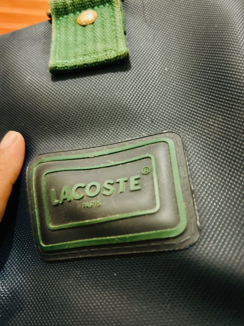 Lacoste travelling bag (Category: Luxury Bags & Wallets) located in Davao. Submitted by japanamerican (Listing ID 1415454552, Image 3). Description: Travelling bag Navy blue color Green strap Vintage .