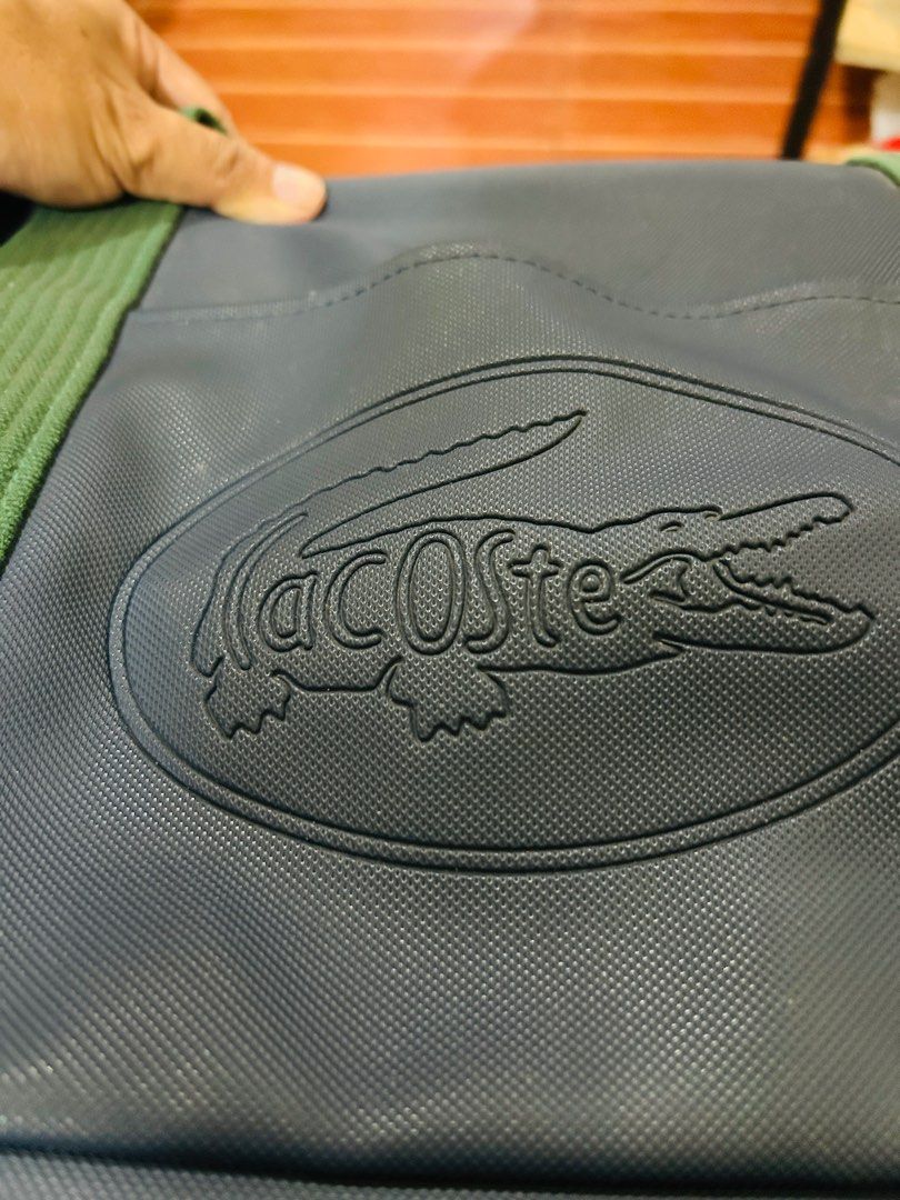 Lacoste travelling bag (Category: Luxury Bags & Wallets) located in Davao. Submitted by japanamerican (Listing ID 1415454552, Image 2). Description: Travelling bag Navy blue color Green strap Vintage .