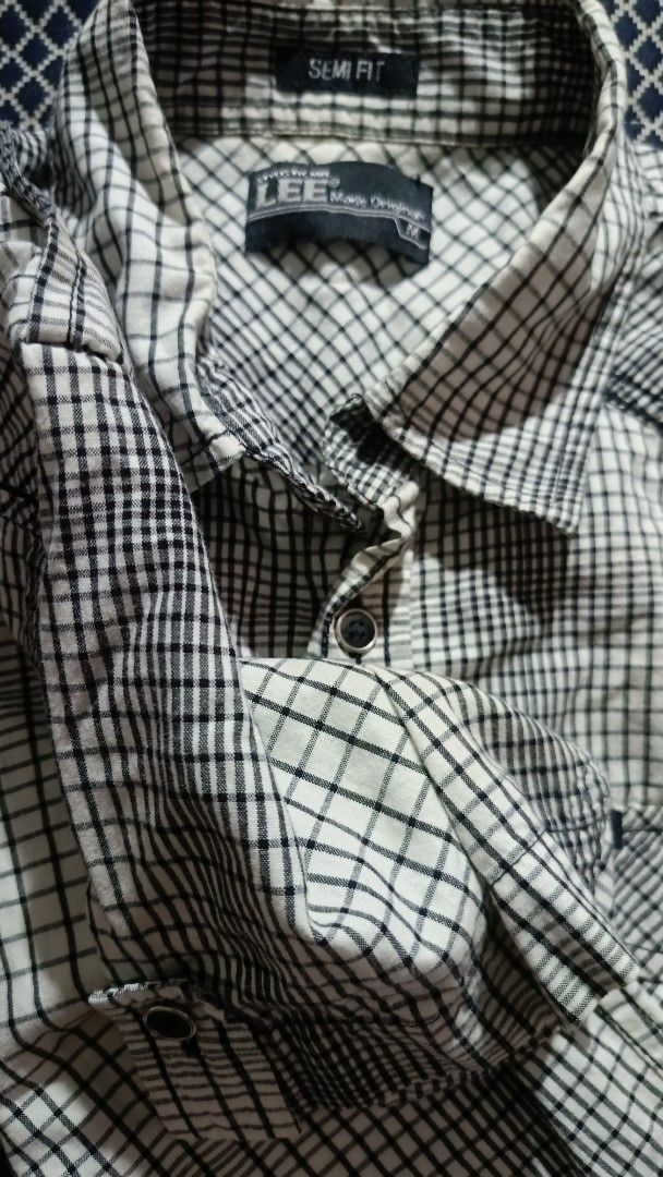 Lee Semi Fit Checkered Shirt (Category: Tshirts & Polo Shirts ) located in General Trias. Submitted by ecsandt (Listing ID 1415491136, Image 3). Description: + Lee checkered polo + Black and white color + Semi-fit style + Button-down front - Two chest pockets - Long sleeves - Features the Lee logo.