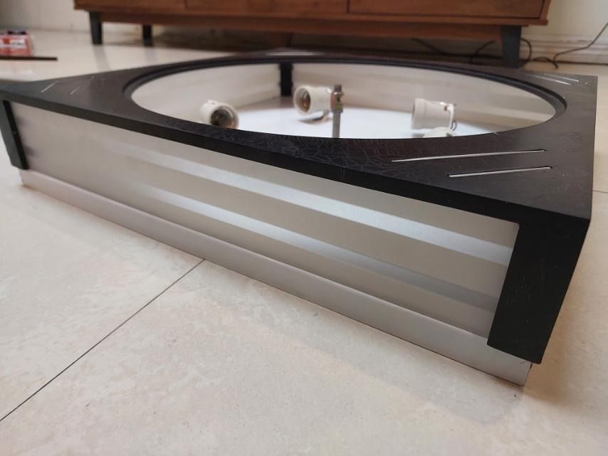 Square ceiling lamp with a white circular light panel (Category: Lighting) located in Manila. Submitted by tradersinc (Listing ID 1415513469, Image 3). Description: Square ceiling lamp with a white circular light panel. The lamp has a black frame with silver accents. The bottom part of the lamp has a white and silver design. The sticker on the lamp indicates the model number JL-LC-9676(5)BK and an original price of P4800.00. Ceiling Lamp for: Din