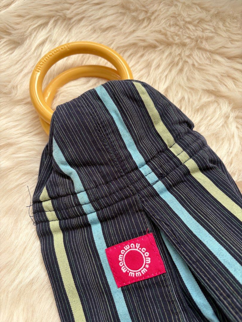 Mamaway Baby Sling (Category: Carriers & Slings) located in Cebu City. Submitted by happyheartcebu (Listing ID 1415456001, Image 3). Description: - Mamaway baby sling - Navy blue and striped design - Includes DVD and original box - Features wooden rings - Mamaway label present - Ready for use - Perfect for keeping baby close and comfortable Bought at Rustans P2,100.