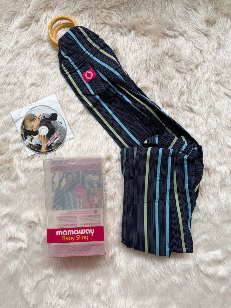 Mamaway Baby Sling (Category: Carriers & Slings) located in Cebu City. Submitted by happyheartcebu (Listing ID 1415456001, Image 2). Description: - Mamaway baby sling - Navy blue and striped design - Includes DVD and original box - Features wooden rings - Mamaway label present - Ready for use - Perfect for keeping baby close and comfortable Bought at Rustans P2,100.