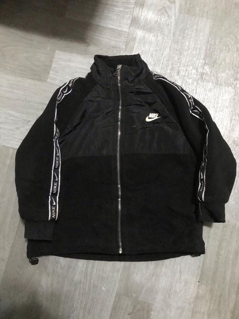 Nike Black Jacket with Logo (Category: Babies & Kids Fashion) located in Paranaque City. Submitted by jayson193 (Listing ID 1415484945, Image 1). Description: - Black Nike jacket - Full zip closure - Nike logo on front and back - White stripe detail on sleeves with Nike logo - High collar - Drawstring at the bottom - Made with a combination of materials.