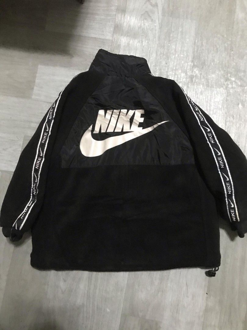 Nike Black Jacket with Logo (Category: Babies & Kids Fashion) located in Paranaque City. Submitted by jayson193 (Listing ID 1415484945, Image 2). Description: - Black Nike jacket - Full zip closure - Nike logo on front and back - White stripe detail on sleeves with Nike logo - High collar - Drawstring at the bottom - Made with a combination of materials.