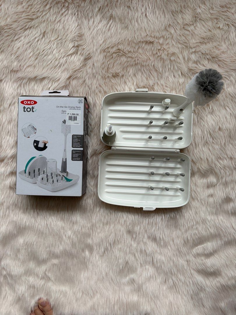 OXO Tot On-the-Go Drying Rack (Category: Breastfeeding & Bottle Feeding) located in Cebu City. Submitted by happyheartcebu (Listing ID 1415451393, Image 1). Description: - OXO Tot On-the-Go Drying Rack - Ideal for baby bottles and accessories - Includes a bottle brush - Compact and portable design - Features pegs for bottles and a water-catching tray - Original price: ₱1,295.00 - Convenient for parents on the go.