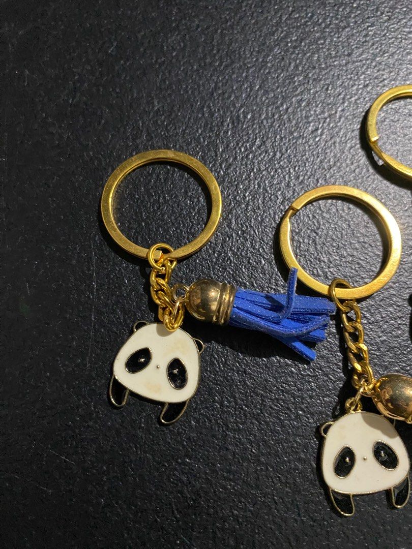 Panda Keychains with Tassels (Category: Charms) located in Valenzuela. Submitted by emg.everythingmustgo (Listing ID 1415555836, Image 2). Description: 100 each - Adorable panda keychain. - Gold-colored ring and chain. - Features a cute panda charm. - Comes with a colorful tassel. - Tassel colors: blue, purple, gray, pink, and green. - Great for keys or bags. - Ideal gift for panda lovers!.