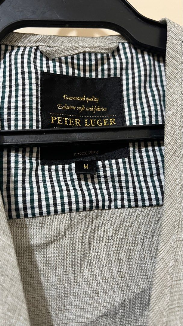 Peter Luger Vest - Size M (Category: Vests) located in General Trias. Submitted by trendythreadsph (Listing ID 1415616864, Image 2). Description: - Peter Luger vest - Size: M - Color: Light grey - Features: Zip closure, multiple front pockets - Lining: Checkered - Design: Classic - Style: Perfect for layering.