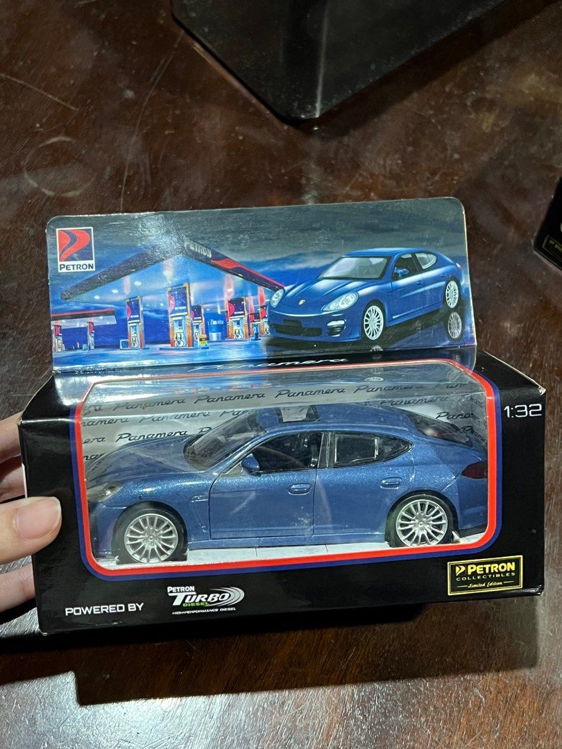 Petron Porsche Panamera 1:32 Scale (Category: Vehicle & Diecast Models) located in Quezon City. Submitted by lloydmagentano (Listing ID 1415572496, Image 1). Description: - Petron Porsche Panamera toy car - 1:32 scale model - Blue color - Includes original box.
