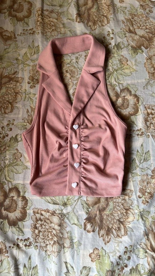 Pink Halter Top with Heart Buttons (Category: Sleeveless) located in Manila. Submitted by nicoleanne84656 (Listing ID 1415465717, Image 1). Description: - Pink halter top - Collared neckline - Heart-shaped buttons - Ruched design - Ribbed fabric - Sleeveless - Cropped length.