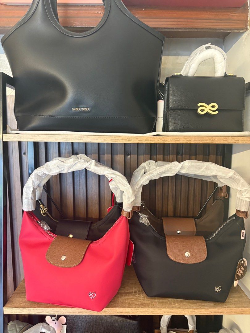 Pony Pony Shoulder Bag (Category: Luxury Bags & Wallets) located in Pasig City. Submitted by gladys100842011 (Listing ID 1415449903, Image 1). Description: - Pony Pony shoulder bags - Available colors: Red, Black, Brown - Features: - Flap closure - Gold-tone button - Heart-shaped logo - Top handle - Detachable shoulder strap - Condition: New with tags.
