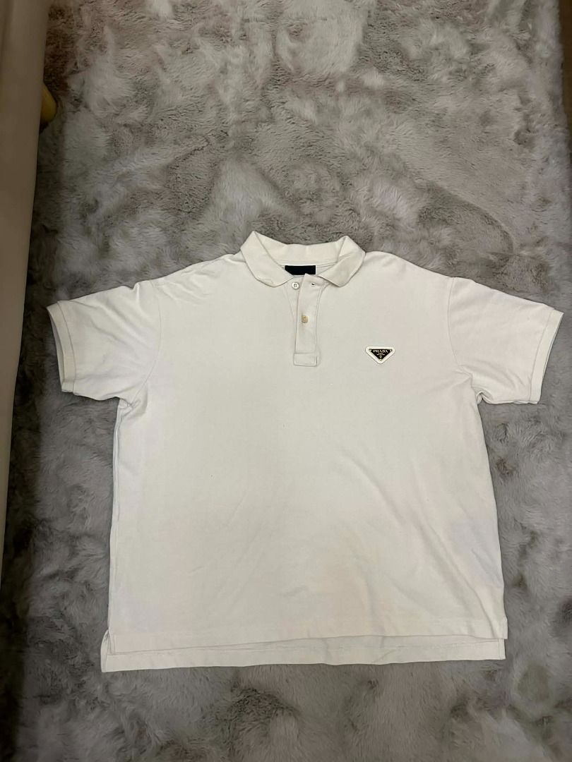 Prada Pique Polo Shirt (Category: Luxury Accessories) located in Davao. Submitted by vip.blvd (Listing ID 1382765780, Image 2). Description: Prada Pique Polo Shirt S DIMENSIONS Chest 23 Shoulder 20 Sleeves 8 Length 25 (Front) Length 26 (Back) ✅ 100% Authentic ✅ Almost brand new (10/10 perfect condition guaranteed) ✅ This item was checked-in, box and paper bag not longer included ✅ Can VC upon shipment ✅ Money-back if fake Selling Price: 8,000 Ret