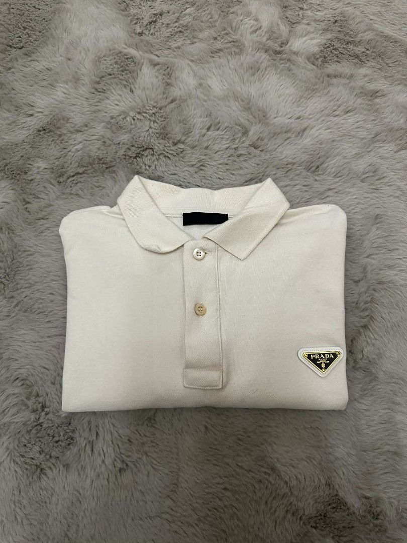 Prada Pique Polo Shirt (Category: Luxury Accessories) located in Davao. Submitted by vip.blvd (Listing ID 1382765780, Image 3). Description: Prada Pique Polo Shirt S DIMENSIONS Chest 23 Shoulder 20 Sleeves 8 Length 25 (Front) Length 26 (Back) ✅ 100% Authentic ✅ Almost brand new (10/10 perfect condition guaranteed) ✅ This item was checked-in, box and paper bag not longer included ✅ Can VC upon shipment ✅ Money-back if fake Selling Price: 8,000 Ret