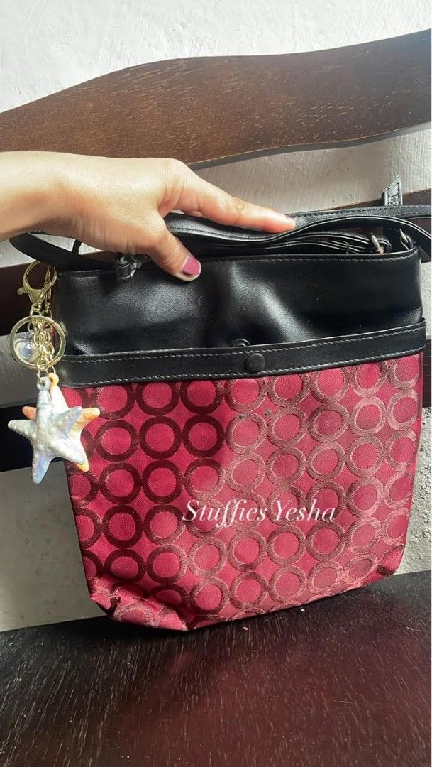 Red and Black Crossbody Bag (Category: Cross-body Bags) located in Manila. Submitted by stuffiesyesha (Listing ID 1415510199, Image 2). Description: - Stylish crossbody bag - Red patterned front, black top - Long, adjustable strap - Decorative charm not included, for Beautification only - Secure button closure - Ideal for daily use or evenings out.
