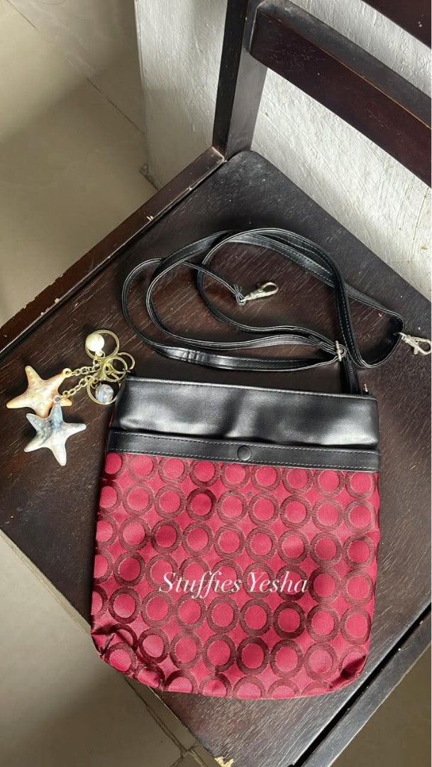 Red and Black Crossbody Bag (Category: Cross-body Bags) located in Manila. Submitted by stuffiesyesha (Listing ID 1415510199, Image 1). Description: - Stylish crossbody bag - Red patterned front, black top - Long, adjustable strap - Decorative charm not included, for Beautification only - Secure button closure - Ideal for daily use or evenings out.