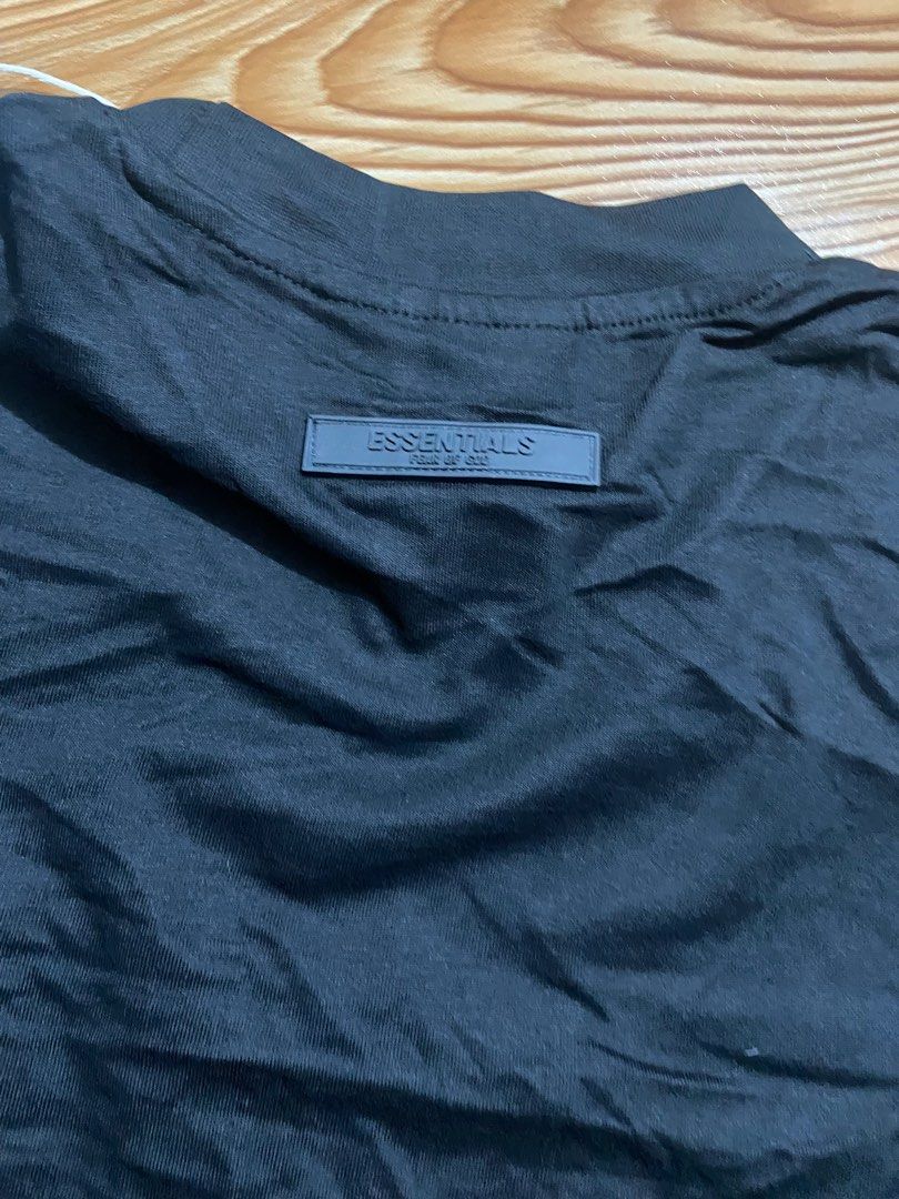 Sale Essentials Fear of God Black T-shirt (Category: Tshirts & Polo Shirts ) located in Manila. Submitted by annshalala (Listing ID 1415573057, Image 3). Description: Fear of God Essentials T-shirt. Size L. Features embossed brand name and Essentials logo. Mock neck. Unworn with tag..