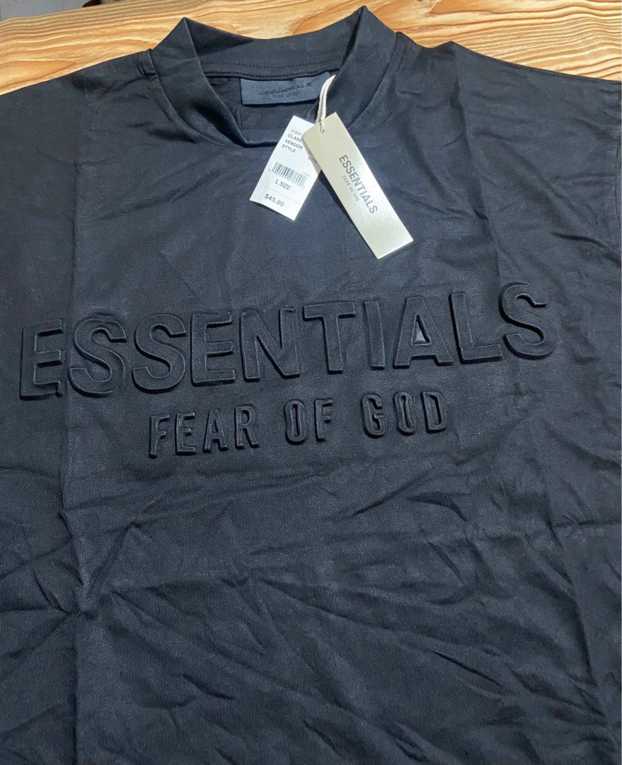 Sale Essentials Fear of God Black T-shirt (Category: Tshirts & Polo Shirts ) located in Manila. Submitted by annshalala (Listing ID 1415573057, Image 2). Description: Fear of God Essentials T-shirt. Size L. Features embossed brand name and Essentials logo. Mock neck. Unworn with tag..