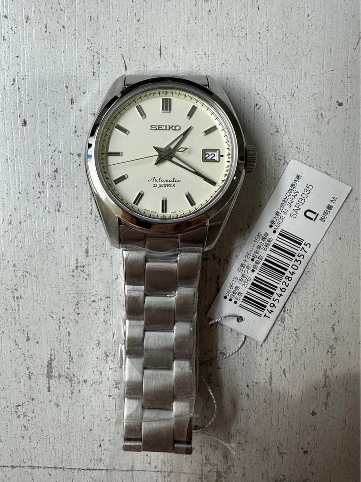 Seiko SARB035 Automatic Watch Brand new (Category: Men's Watches) located in Manila. Submitted by welltimedcollective (Listing ID 1415506133, Image 3). Description: Sarb035 aka "Grand baby seiko" Discontinued/rare JDM watch Seiko SARB035 Movement: Seiko 6R15 automatic (hacking + hand-winding) Power Reserve: ~50 hours Case: Stainless steel, ~38 mm diameter × ~11.2 mm thick Crystal: Sapphire crystal Dial: Cream/white w/ date at 3 o’clock Bracelet: 