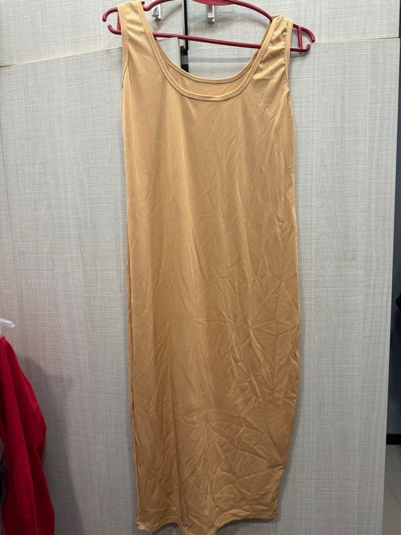 Sleeveless Midi Maternity Dress (Category: Dresses) located in Quezon City. Submitted by anj_chan (Listing ID 1415511142, Image 1). Description: - Sleeveless midi dress - Available colors: beige, burgundy, mint green, white, gray - Features a scoop neckline - Straight, body-hugging silhouette - Smooth, likely stretchy fabric - Perfect for layering Fits M-XL Take all 5pcs 600.