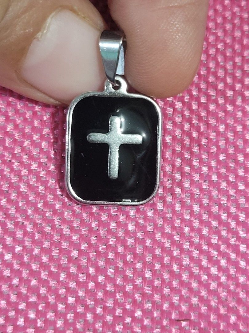 STAINLESS SILVER BLACK CROSS PENDANT (Category: Necklaces) located in Taguig. Submitted by roumie (Listing ID 1415590374, Image 2). Description: STAINLESS SILVER BLACK CROSS PENDANT brand new and sealed what you is what you get made of solid stainless non tarnish and non fade with free velvet pouch.