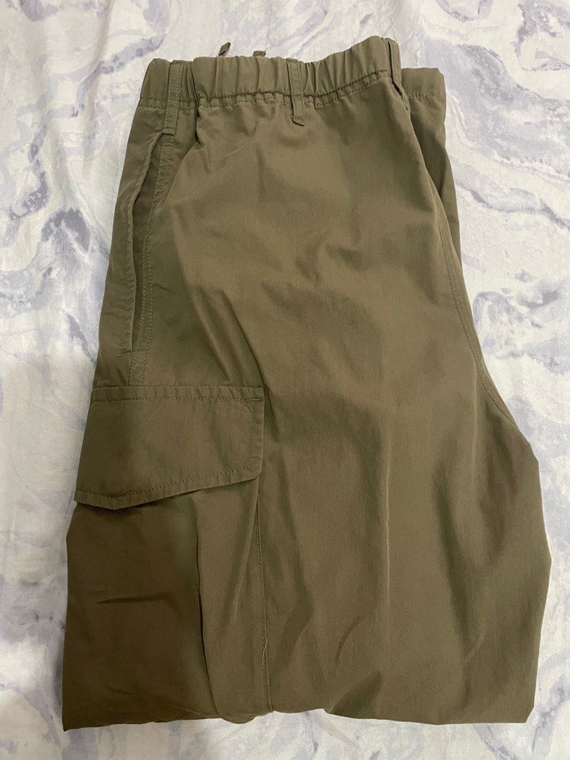 Uniqlo Wide Parachute Pants - Size S (Category: Other Bottoms) located in Taytay. Submitted by zipzyzan (Listing ID 1415511162, Image 1). Description: - Uniqlo Cargo Pants - Size: S - Color: Olive Green - Features: Drawstring waist, cargo pocket - Made in Indonesia - Waist Size: 68-76cm - Material: - Body: 66% Cotton, 34% Nylon - Pocket Lining: 65% Polyester, 35% Cotton.