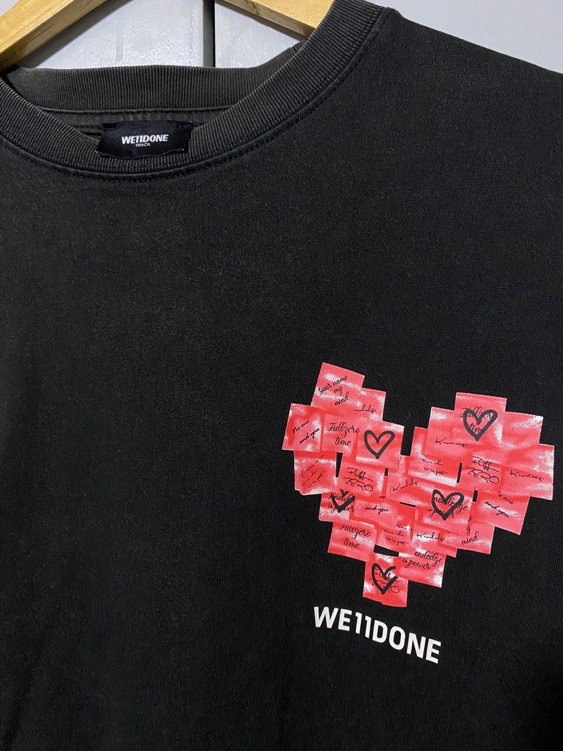 We11done Heart Graphic T-shirt (Category: Tshirts & Polo Shirts ) located in San Fernando. Submitted by sthriftven (Listing ID 1415586284, Image 2). Description: WE11DONE PINK HEART W: 22 L: 28 Good Condition Color rate: 8/10 issue: none CLAIM: 400.
