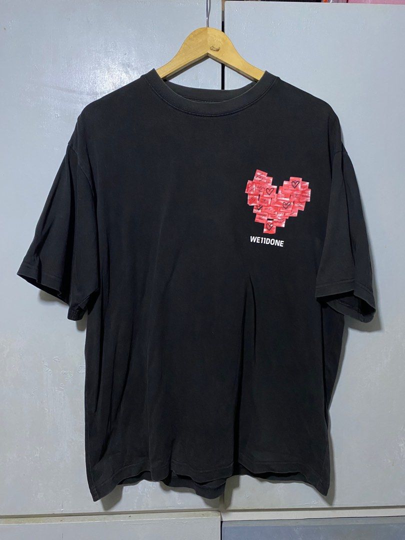 We11done Heart Graphic T-shirt (Category: Tshirts & Polo Shirts ) located in San Fernando. Submitted by sthriftven (Listing ID 1415586284, Image 1). Description: WE11DONE PINK HEART W: 22 L: 28 Good Condition Color rate: 8/10 issue: none CLAIM: 400.