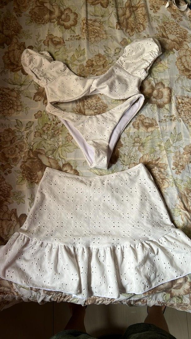 White Eyelet Bikini Set with Skirt (Category: Bikinis & Swimsuits) located in Manila. Submitted by nicoleanne84656 (Listing ID 1415465361, Image 1). Description: - White eyelet bikini set - Off-shoulder top - Matching skirt with ruffled hem - Lightweight fabric - Ideal for beach days and summer getaways - Stylish and comfortable - Only wore onc but if you're picky. You can just throw away the thong.