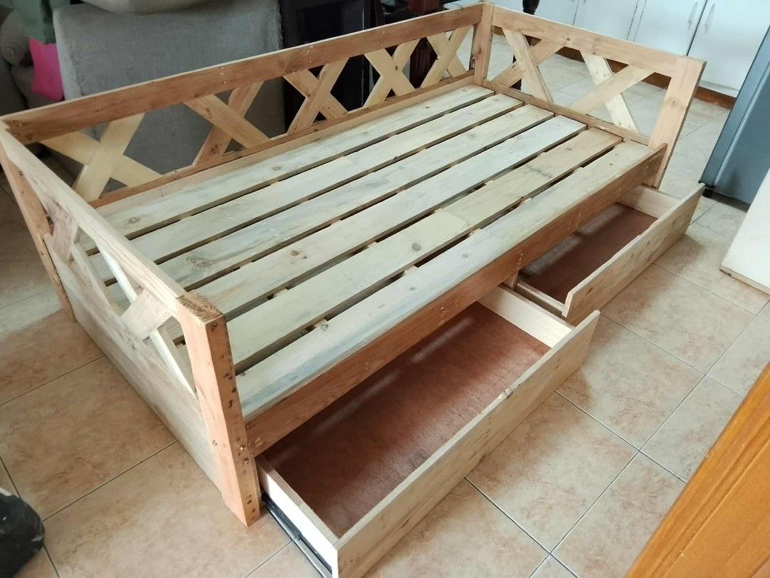 Wooden Sofa Bed with Storage Drawers (Category: Sofas) located in Manila. Submitted by jovetph. (Listing ID 1415518164, Image 2). Description: Handcrafted wooden sofa bed with natural finish. Features storage drawers and armrests. Matching side table available. Ideal for small spaces..