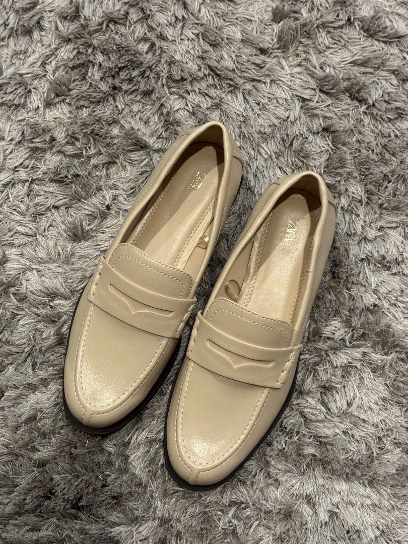 Zara Loafers - Beige (Category: Loafers) located in Makati City. Submitted by MyPurchases2021 (Listing ID 1415595025, Image 3). Description: - Zara beige penny loafers - Size 36 - Classic penny loafer design - Rounded toe - Dark brown soles - Smooth material.