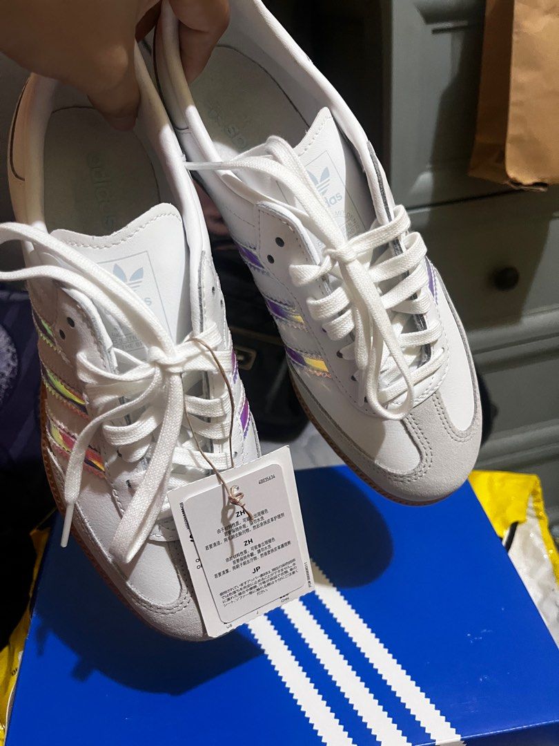 Adidas Samba OG J Sneakers (Category: Sneakers) located in Paranaque City. Submitted by maineshar19 (Listing ID 1415805117, Image 2). Description: - Adidas Samba OG J sneakers - White with iridescent stripes - Suede toe cap - Gum sole - New with tags - Size: UK 4.5 / US 4 / EU 36 2/3 / JP 230-225 - Includes original box.