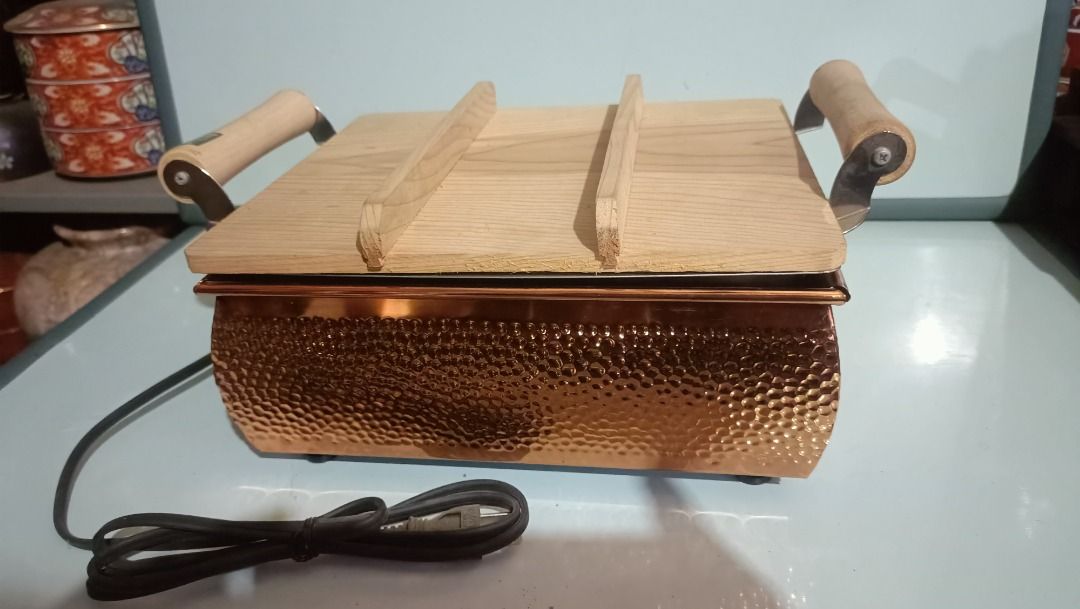 Ajiichi Electric Oden Pot (Category: Cookware & Accessories) located in Munoz. Submitted by larryc1212 (Listing ID 1415768219, Image 1). Description: - Japanese Ajiichi Electric Oden Pot - Copper-plated exterior, stainless steel interior - Includes wooden lid and handles - Comes with stainless steel trays and plates - Original box and instruction manual included - 110volts (from Japan) Item may include some scratches due to age, as is were is bas