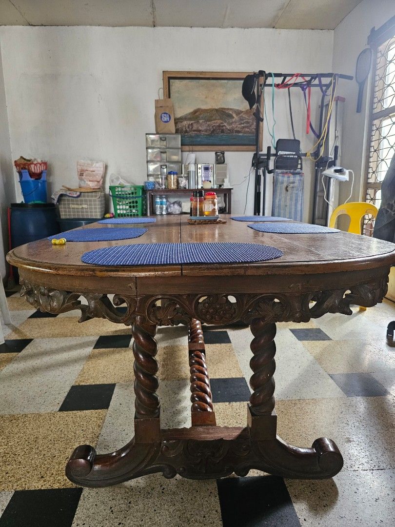 Antique Wooden Dining Table (Category: Tables & Sets) located in Quezon City. Submitted by zeyanne (Listing ID 1415741249, Image 2). Description: - Antique wooden dining table - Oval shape - Unique carved design - Rich, warm wood tone - Sturdy, detailed base - Adds classic style to your dining area MOP: Gcash pick up only .