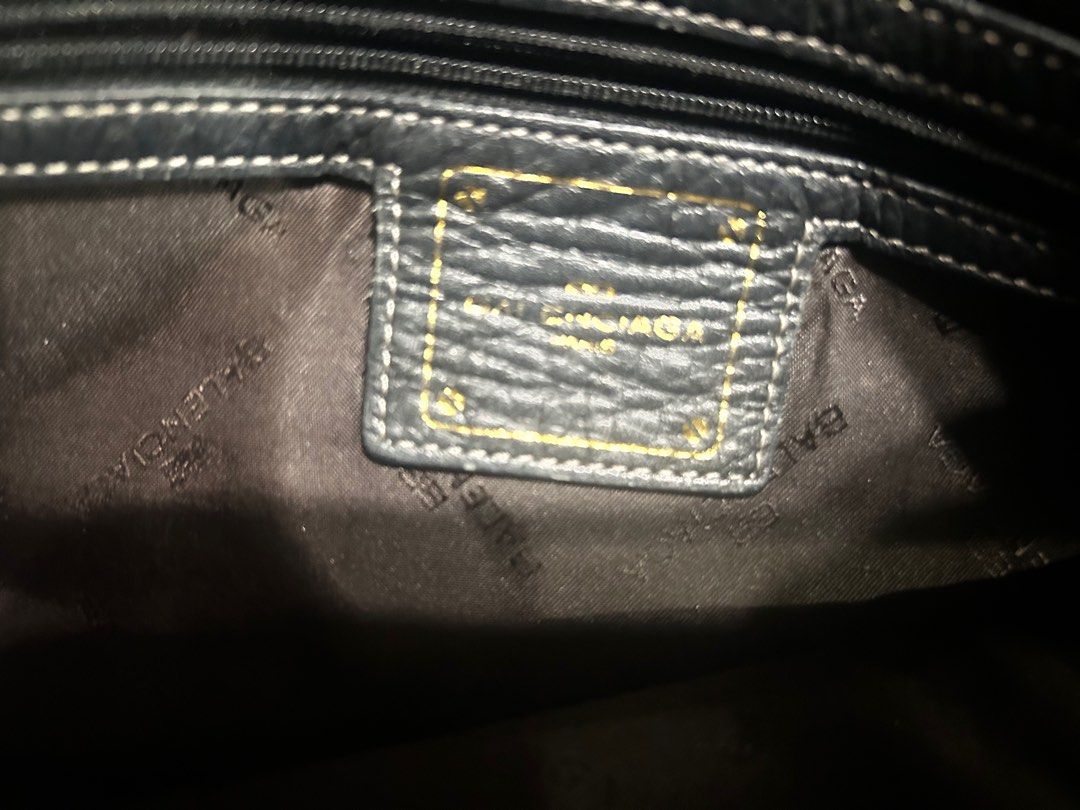 Balenciaga Black Leather Handbag (Category: Luxury Bags & Wallets) located in Marikina City. Submitted by tresariascats (Listing ID 1415821918, Image 3). Description: - Authentic Balenciaga handbag - Black leather - Top handle and shoulder strap - Interior zippered pocket - Branded lining - Decorative buckle detail with Balenciaga logo - Interior leather tag with brand name.