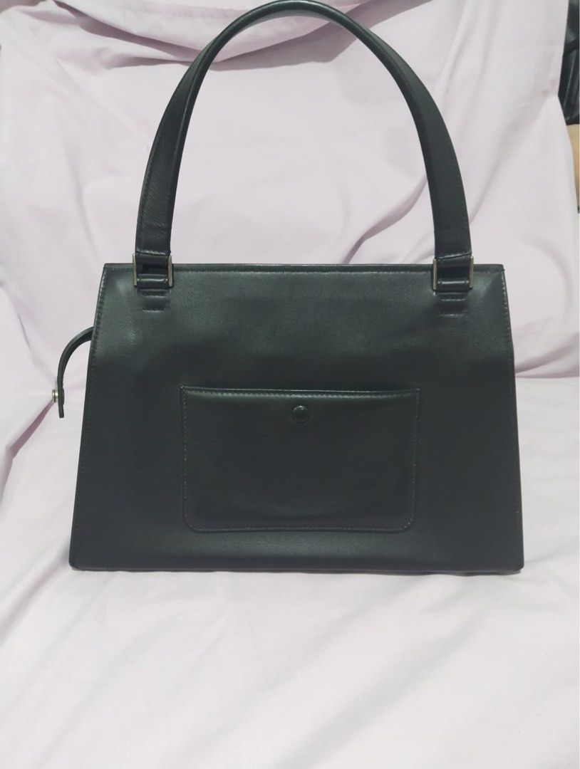 Celine Handbag with Blue Snakeskin (Category: Luxury Bags & Wallets) located in Manila. Submitted by cooldolphin-c87b62 (Listing ID 1415708915, Image 2). Description: - Authentic Celine handbag - Black leather and blue snakeskin exterior - Top handle design - Secure zippered closure - Interior lined with black fabric - Convenient back pocket - Protective metal feet on the bottom - Celine logo visible inside.