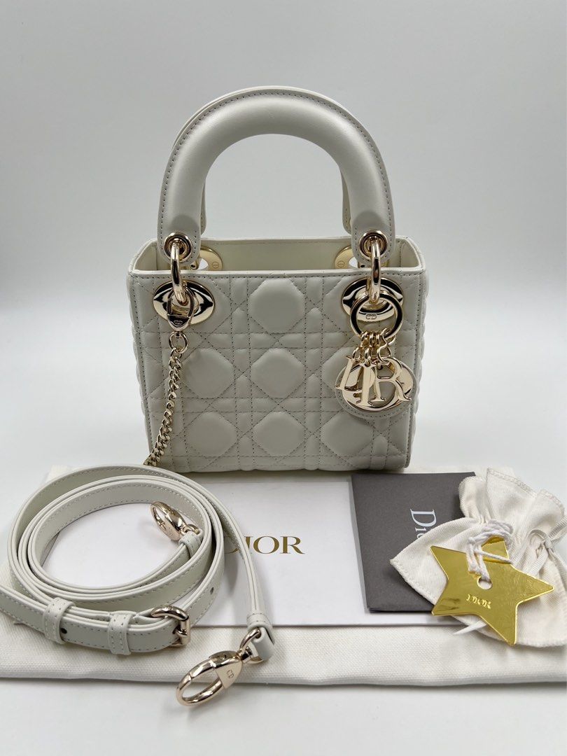 ⚜️Christian Dior - Lady Dior Mini bag (Category: Luxury Bags & Wallets) located in Makati City. Submitted by 90sangel (Listing ID 1415778445, Image 1). Description: •Item: Lady Dior mini bag in white🍦🍨🐚⚜️🤍 •Size: Mini •Condition: As New! No hidden issue. Light gold hardware ~ rare and hard to find *Includes dustbag, cards & big paperbag ~ .