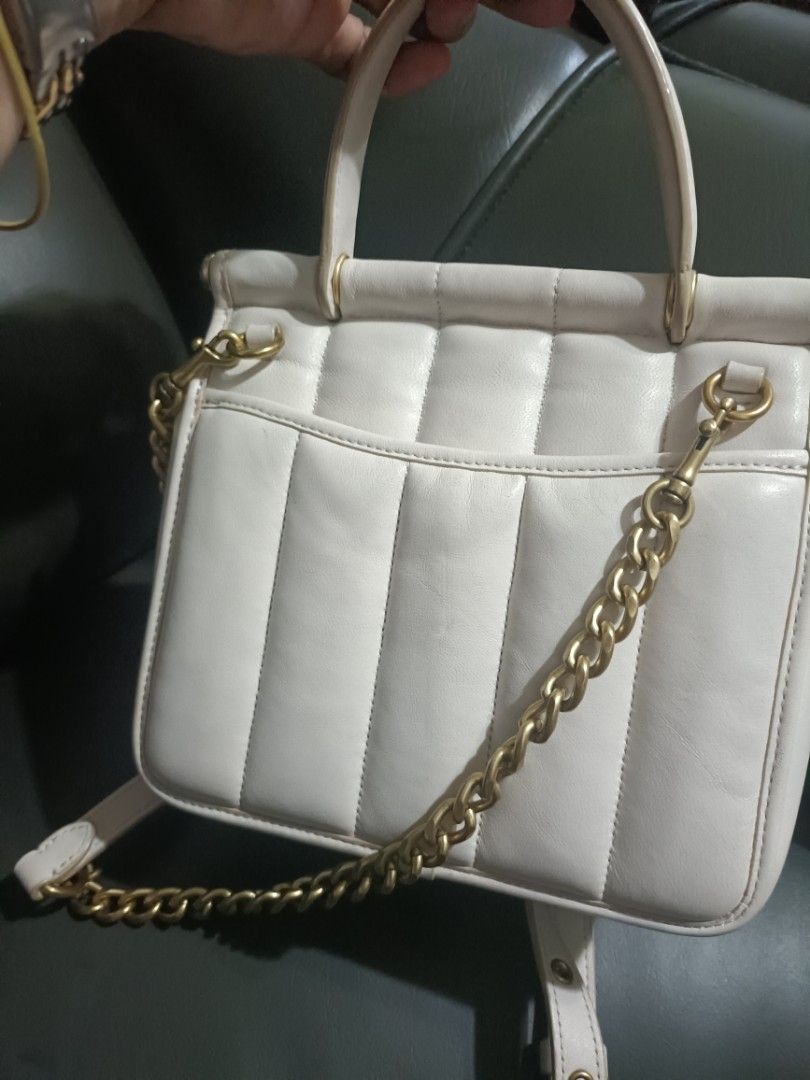 Coach Willis 18 Bag (Category: Luxury Bags & Wallets) located in Imus. Submitted by conshaps28117 (Listing ID 1415723261, Image 2). Description: - Coach Willis 18 - Limited edition - Quilted design - Top handle - Gold chain strap - Turnlock closure - Interior zippered pocket - Coach embossed creed inside - Off white with gold-tone hardware, no fading - Detachable strap - in very good condition -comes with own dustbag.