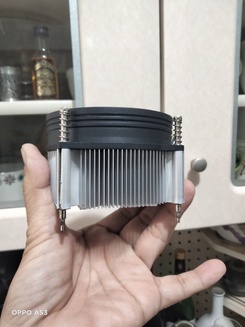 Cooler Master CPU Cooler (Category: Computer Parts) located in Carmona. Submitted by rpute (Listing ID 1415628425, Image 2). Description: Cooler Master CPU cooler with a black fan and silver heatsink. Features a circular fan design with multiple blades. Includes a connector for power. The heatsink has a series of fins for heat dissipation. The cooler is designed to be mounted on a CPU..