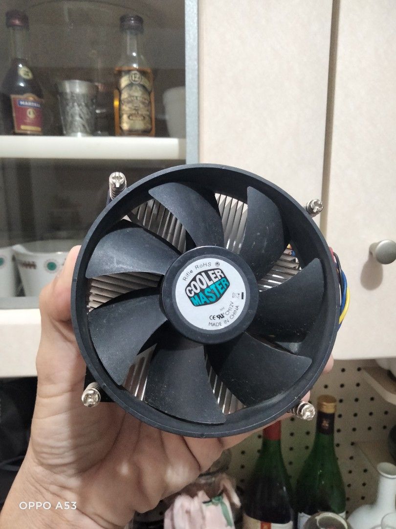 Cooler Master CPU Cooler (Category: Computer Parts) located in Carmona. Submitted by rpute (Listing ID 1415628425, Image 1). Description: Cooler Master CPU cooler with a black fan and silver heatsink. Features a circular fan design with multiple blades. Includes a connector for power. The heatsink has a series of fins for heat dissipation. The cooler is designed to be mounted on a CPU..
