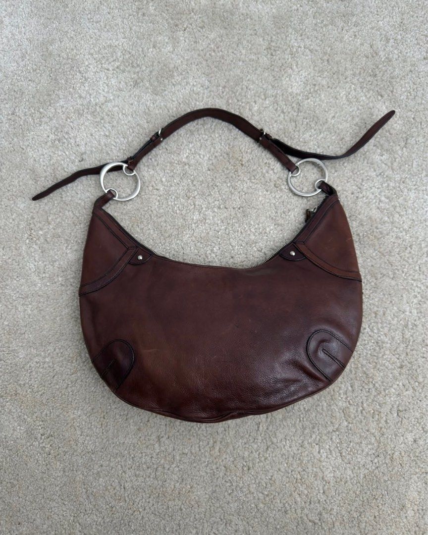 DKNY Vintage Y2K Hobo Bag (Category: Shoulder Bags) located in San Nicolas. Submitted by ihascat (Listing ID 1415745313, Image 3). Description: • dark brown • leather tassel • zippered • Silver hardwares • genuine leather 29 × 382-3 cm.