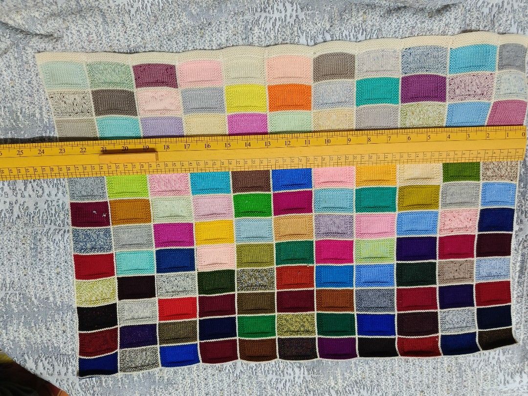 Handmade Patchwork Blanket (Category: Cushions & Throws) located in Karangan. Submitted by khaifira1412 (Listing ID 1415810481, Image 3). Description: - Handmade patchwork blanket - Colorful design with various rectangular patches - Colors include blue, green, red, and yellow - Cream-colored border - Size reference available in the photo.