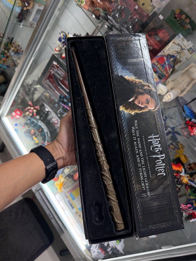 Harry Potter Hermione Granger Wand (Category: Western Merchandise) located in Makati City. Submitted by japankycollection (Listing ID 1415658213, Image 2). Description: - Hermione Granger's wand - Features an illuminating tip (UNTESTED) - Comes in original box - Box has image of Hermione Granger and Harry Potter logo - Wand is brown plastic.