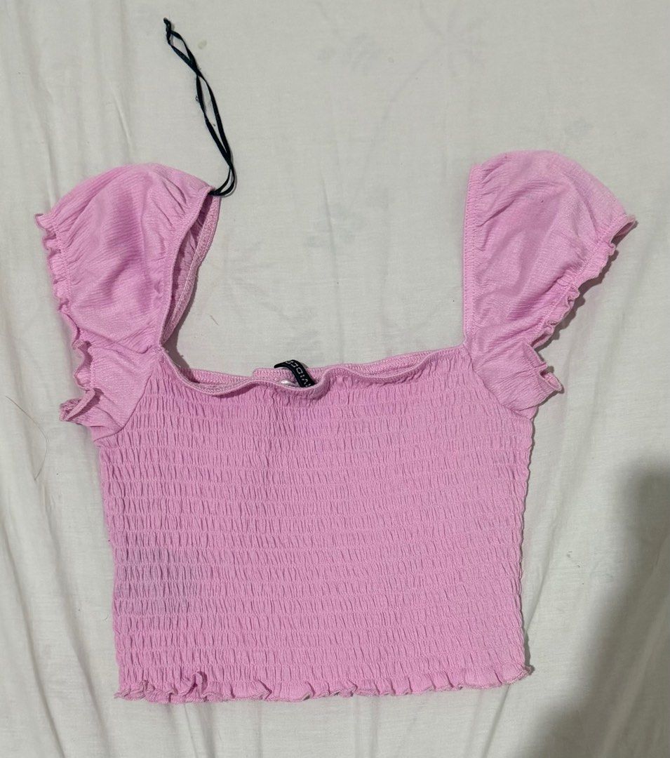 H&M Pink Smocked Crop Top (Category: Sleeveless) located in Caloocan City. Submitted by sunooberi (Listing ID 1415754258, Image 2). Description: - H&M crop top - Square neckline - Ruffled sleeves - Smocked bodice - Light pink color - Brand new with tag - Great with high-waisted bottoms.