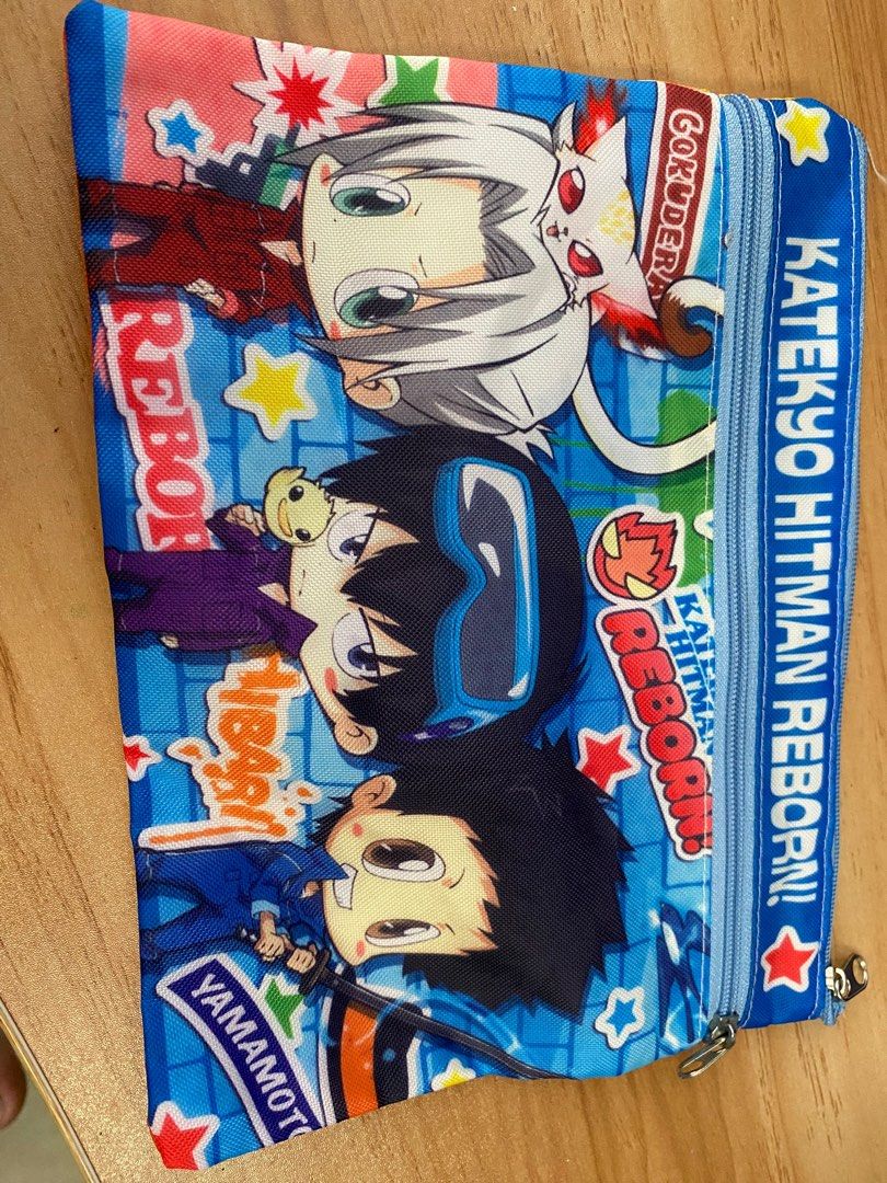 Katekyo Hitman Reborn! Pencil Case (Category: Stationery & School Supplies) located in Maramag. Submitted by everythingjapananduk (Listing ID 1415680192, Image 1). Description: - Katekyo Hitman Reborn! themed pencil case. - Features character designs on both sides. - Blue zipper closure. - Rectangular shape. - Made of fabric. - Perfect for storing pens, pencils, and small accessories..