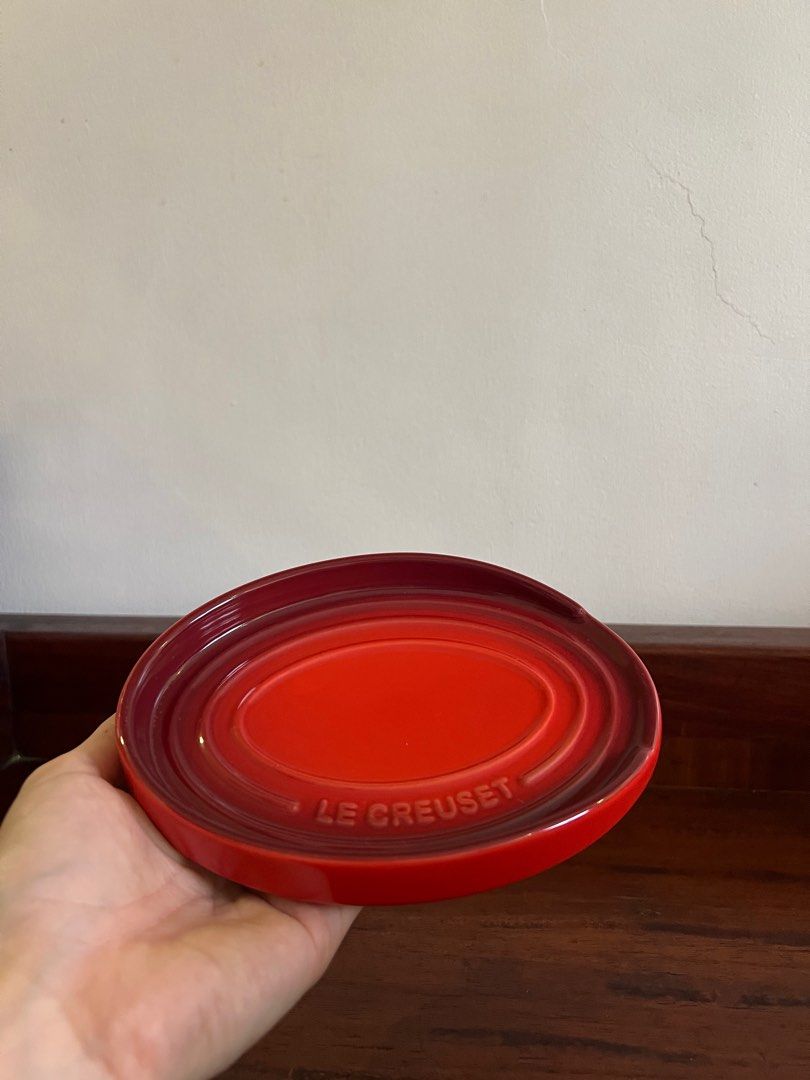 Le Creuset Oval Spoon Rest (Category: Dinnerware & Cutlery) located in Manila. Submitted by kitkat24 (Listing ID 1415653857, Image 2). Description: - Le Creuset oval spoon rest - Vibrant red color - Embossed Le Creuset logo - Designed for spoons and cooking utensils - Classic oval shape with raised edge - Premium durable stoneware - Beautiful colored glaze - Easy clean up.