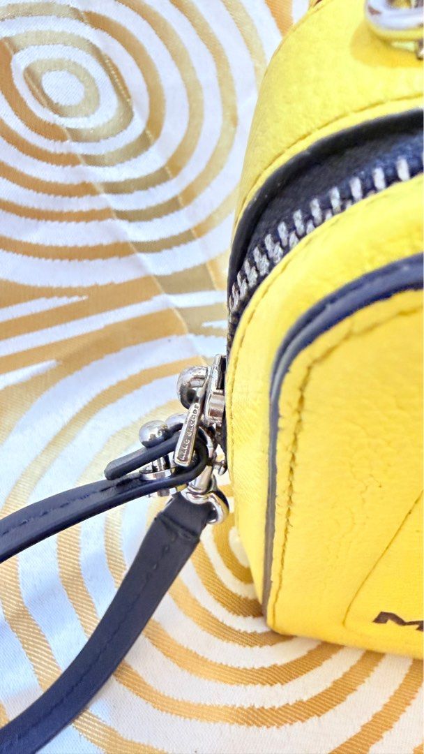 Marc Jacobs The Box Bag (Category: Luxury Bags & Wallets) located in Mabalacat. Submitted by yhummy21 (Listing ID 1415815442, Image 3). Description: - Authentic Marc Jacobs The Box Bag - Bright yellow color - Top handle and detachable shoulder strap - Rectangular shape - Secure zip closure - Black accents and silver hardware - Interior brand tag.