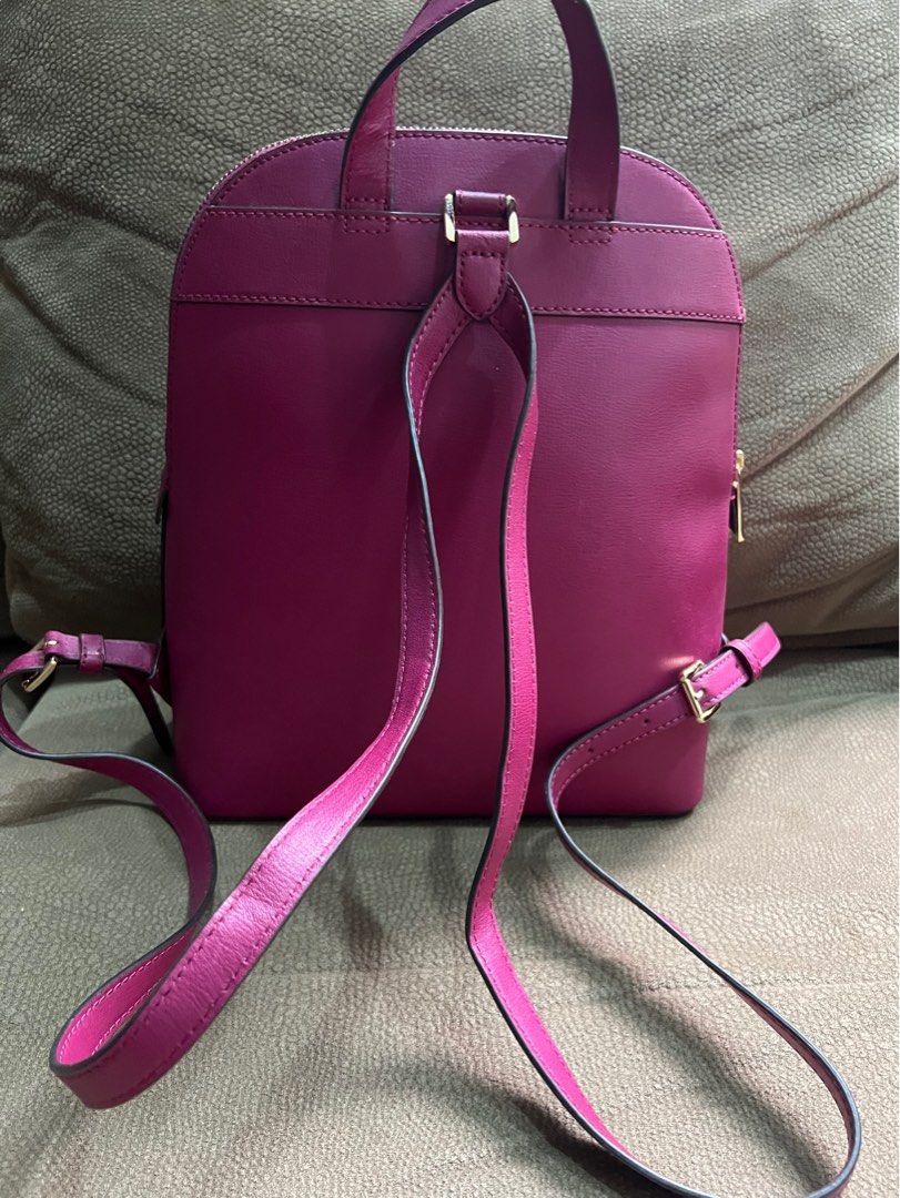 MK Michael Kors Emmy Large Dome Backpack - Magenta (Category: Backpacks) located in Quezon City. Submitted by bfindsph_26 (Listing ID 1415799457, Image 2). Description: Michael Kors Emmy Large Dome Backpack Color: Magenta (also listed as Deep Burgundy) Material: Saffiano leather Used only 2x like new condition — no major flaws. Zip-around top closure, adjustable shoulder straps, and gold-tone hardware. Bought in the USA #MichaelKors #MKBackpack #