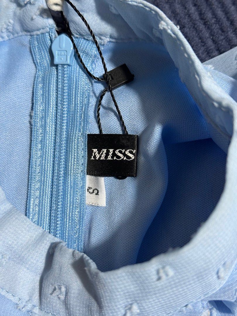 MISS Blue Tiered Dress (Category: Dresses) located in Baguio. Submitted by tamarands (Listing ID 1415722429, Image 2). Description: - Light blue tiered dress - Size: S - Features: - Long sleeves - Flared cuffs - High neckline - Back zipper closure - Brand tag visible.